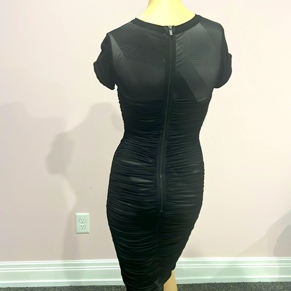 Never worn BCBG mesh overlay black dress asymmetrical designs underneath size XS - Picture 3 of 5